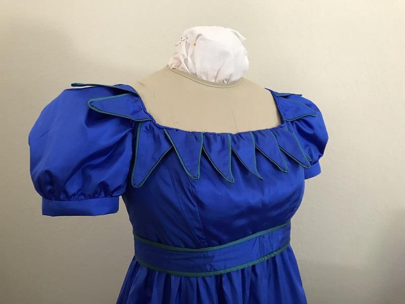 Reproduction 1820s Blue Dress with Van Dyke Points Bodice Right Quarter View. 