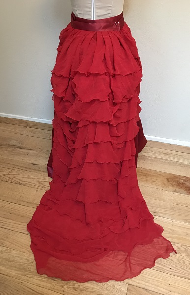 1870s Reproduction Red Polyester Overskirt Back.