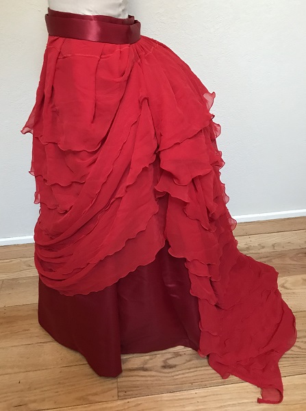 1870s Reproduction Red Polyester Overskirt Left. 
