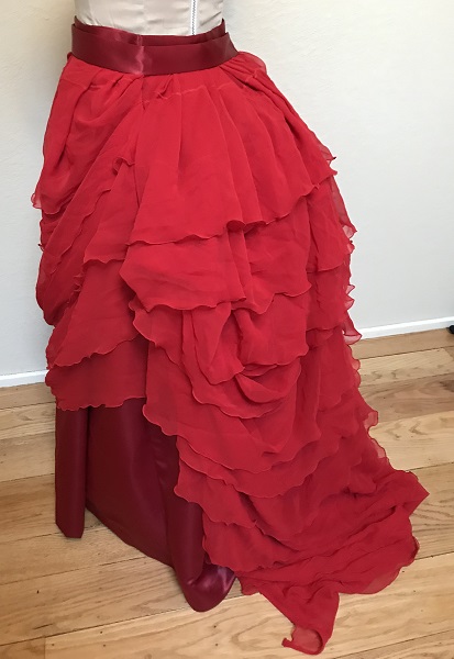 1870s Reproduction Red Polyester Overskirt Left Quarter View.