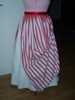 Reproduction 1887 red stripe bustle overskirt: back view