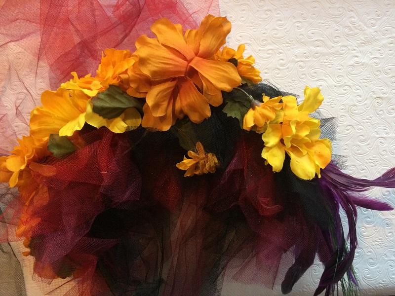 burgandy, red, black tulle with marigold flower headdress