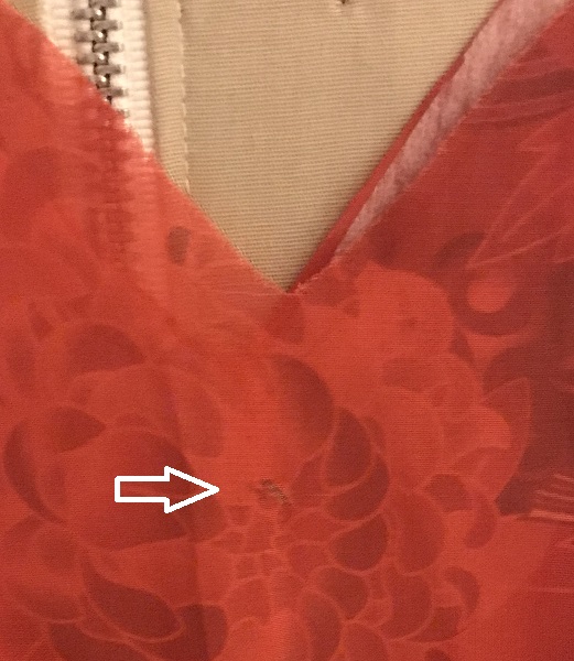 Detail of flaw in fabric. 
