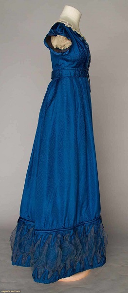 Augusta Auctions:COBALT SILK EVENING GOWN, 1820s Figured cobalt blue silk, empire bodice w/ laced V front satin panel, short cap sleeves, Lille lace trim, inset waist band, mesh puff hem trims. Right 