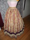 1860s reproduction striped evening dress skirt left three quarter view