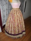 1860s reproduction striped evening dress skirt right three quarter view