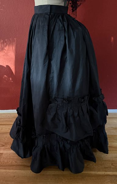 1870s Reproduction Black Watteau Silk Underskirt Left. 
