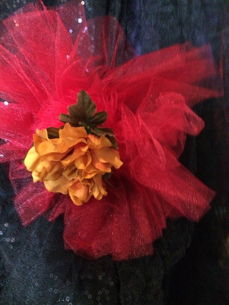 burgandy, red, black tulle with marigold flower pins