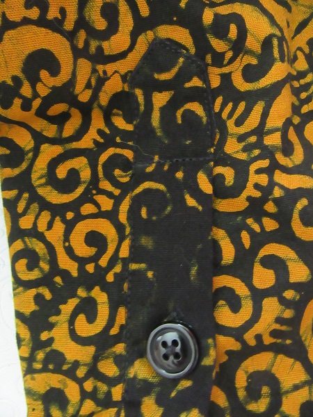 2010s Men's Orange and Black Batik Shirt Sleeve Placket Detail