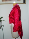 women's red and pink satin tailcoat left view
